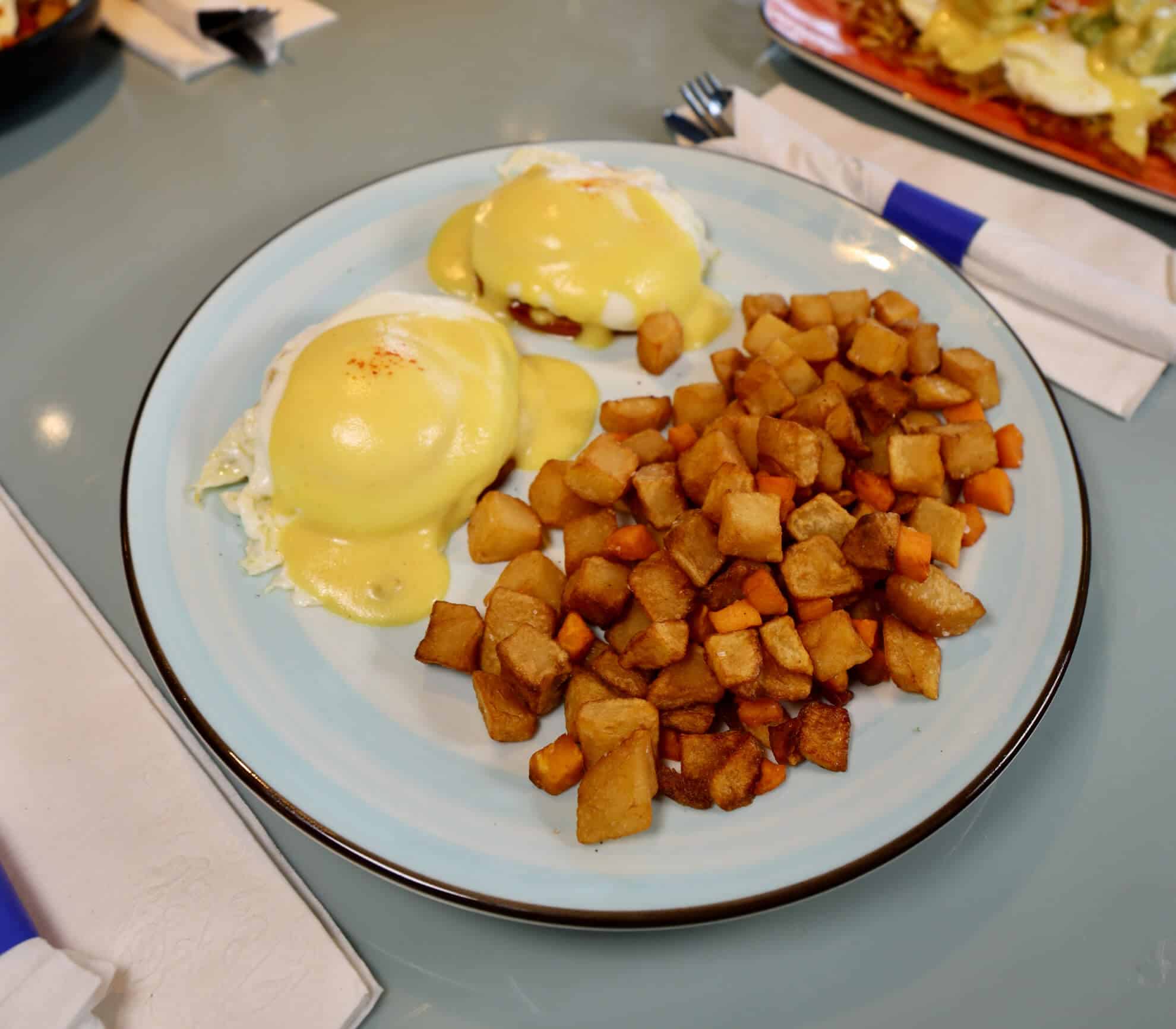Classic Benedict with hollandaise and post potatoes at The Morning Post
